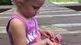 Toddler disciplines a worm