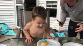 Toddler cannot blow out candle