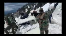 Indian army rescues top government official and his driver after they were trapped under an avalanche snow