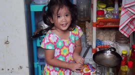 Cute Kid Helping Her Older Sister To Cook Instant Noodle In The Kitchen
