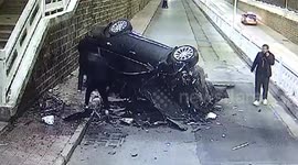 Car flies over overpass in China and smashes into wall after driver accidentally presses accelerator