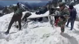 Indian army rescues government official and his driver after they were trapped in an avalanche
