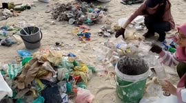 Group of volunteers cleaning up local beach at Terengganu Malaysia