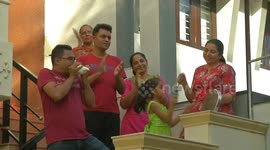 Residents of Indian housing society cheer on essential workers during coronavirus lockdown