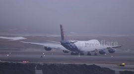 Atlas Air 747-8F operated for Qantas departing Anchorage in foggy conditions