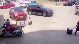 Car runs over girl playing in front of it in China
