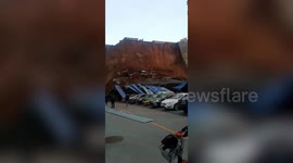 Garage collapses and vehicles buried after landslide hits Chinese residential community