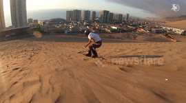 Adrenaline junkies hit the slopes of Chile SANDBOARDING down the dunes