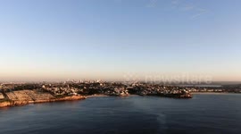 Drone view of Sydney cityscape at sunrise on ANZAC day 2020 showing the words Lest We Forget