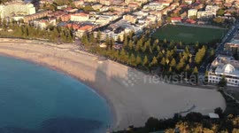 Social distancing laws are relaxed to allow people their traditional ANZAC day swims in Sydney