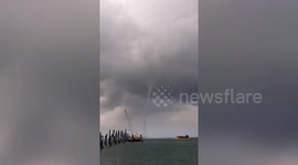 Waterspout forms off Thai coast amid tropical storms