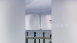 Beachgoers amazed as huge waterspout swirls near Cambodian island
