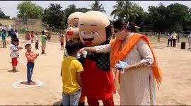 Indian cartoon character Motu-Patlu distributes masks for children in neighbourhood