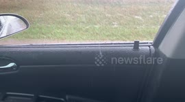 Large storm dumps hailstone through car window after heavy storms cross parts of South Dakota