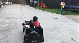 Very cute Cooper Lewis aged 3 and Maizie aged 2 have the best transport while in lockdown