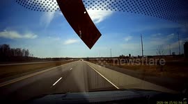 Driver narrowly avoids smashed windscreen from flying debris in Canada