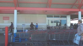 Long lines wrap around Costco store on Mavis road in Mississauga Canada due to COVID 19 physical distancing regulations to help stop coronavirus spread