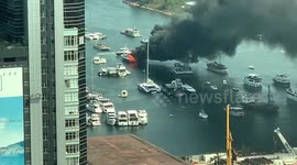 Large plume of smoke rises over Hong Kong's Victoria Harbour after three boats catch fire
