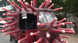 Indian artist designs COVID-19-themed rickshaw to raise awareness about the pandemic