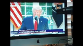 Hilarious Malaysian man tries to fix Trump's hair on Mac Screen