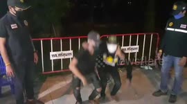 Coronavirus curfew violators forced to do squats on Thai roadside