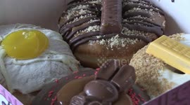 Customers queue to buy Doughnuts and essential items