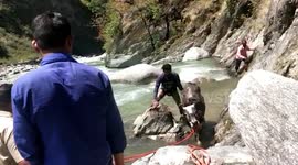 Law enforcement officials brave strong water flow, rescue cow trapped in ditch in northern India