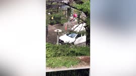 Tropical downpour causes flash flooding on roads in Bangkok, Thailand