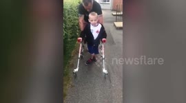 Brave disabled boy defies medical predictions by doing charity walk