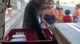 Kind Filipino family hand out free meals to locals who are badly affected by coronavirus lockdown