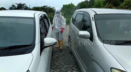 Vehicles sprayed with disinfectant during COVID-19 pandemic in Indonesia