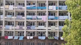 University in China hangs out quilts for students as requested before it reopens