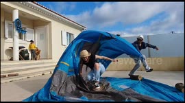 Portuguese father takes his kids 'surfing' during COVID-19 lockdown