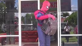 Spidermen costumed men distribute masks and hand sanitaizers to relieve stress from residents of Covid-19