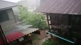 Tropical storm batters northern Thailand as residents shelter inside homes