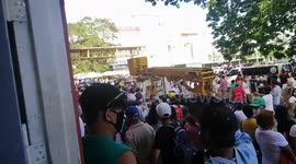Residents struggling with coronavirus downturn queue for cash handouts in the Philippines
