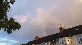 Rainbow, symbol of hope, gleams over Londoners clapping for frontline COVID workers