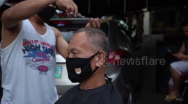 A barber offering haircut services on the streets during COVID19 lockdown