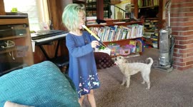 Rescue dog's howls harmonise with five-year-old playing slide whistle