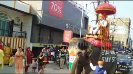 Indian prime minister impersonator rides elephant while broadcasting messages about COVID-19
