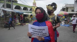 Volunteers dressed costumes superheroes' raise awareness about coronavirus in Indonesia