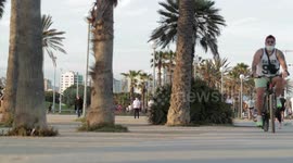People out along the beach promenade for the first day of exercise after 7 weeks of lockdown in barcelona, spain