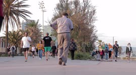 Spaniards out along the beach promenade for the first day of exercise after 7 weeks of lockdown