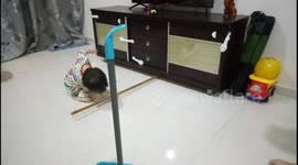 Diligent toddler doing housework during coronavirus lockdown