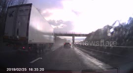 HGV Nearly slams car into barrier on motorway.