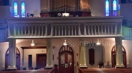 Organist plays during a mass in an empty church