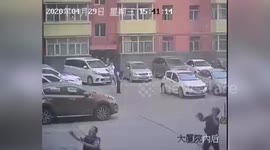 Policeman catch a woman jumping off a building in China