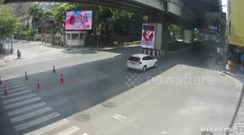 Shocking moment driver smashes into motorcycle rider and girlfriend after 'trying to beat red light at junction'