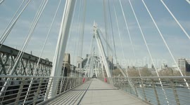 Lockdown London, Empty Hungerford Bridge, Golden Jubilee Bridges and River Thames during coronavirus pandemic, no people