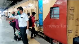 Migrants from Northern India take train to their respective village from Western India.